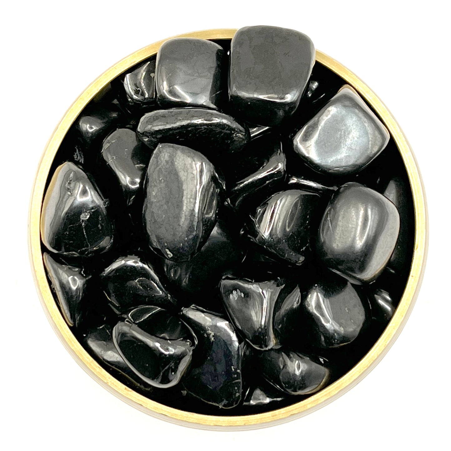 Bowl of polished shungite tumbled stones for healing and purification.