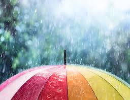 Colorful umbrella in the rain, symbolizing protection and resilience during emotional storms.