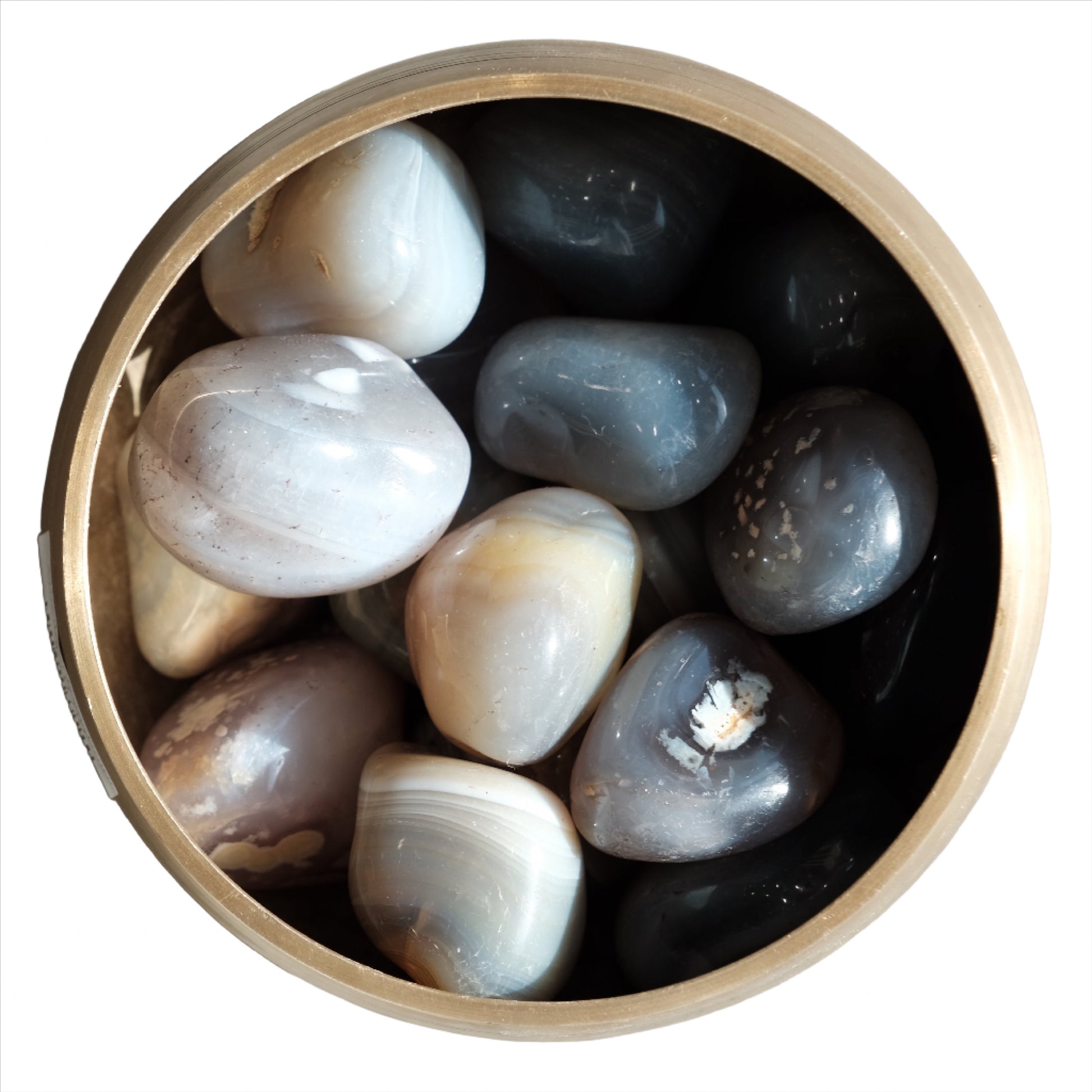 Bowl of polished agate tumbled stones for healing and balance, offering comfort and enhancing focus.