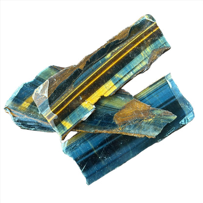 Blue Tiger Eye Slab pieces showcasing rich colors, symbolizing balance, insight, and prosperity through healing properties.