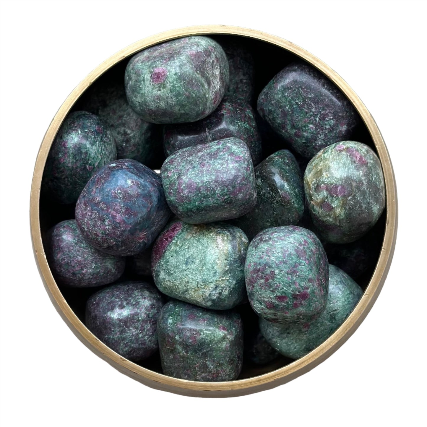 Ruby Zoisite tumbled stones with green and red hues in a circular container, promoting happiness and positive energy.