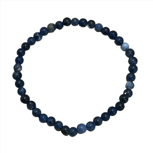Sodalite bracelet with 4MM beads, enhances intuition and analysis, featuring deep blue stones in a circular arrangement.