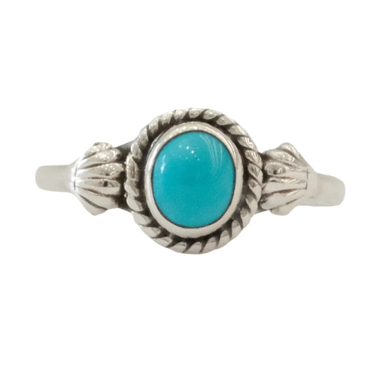 Turquoise sterling silver ring, size 7, featuring an elegant design with a central turquoise gemstone.