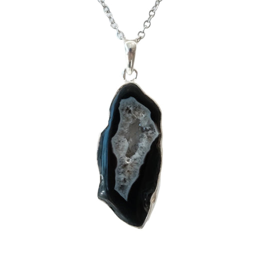 Agate Slice Sterling Silver Pendant Necklace with calming Blue Lace Agate, promoting self-assurance and healing benefits.