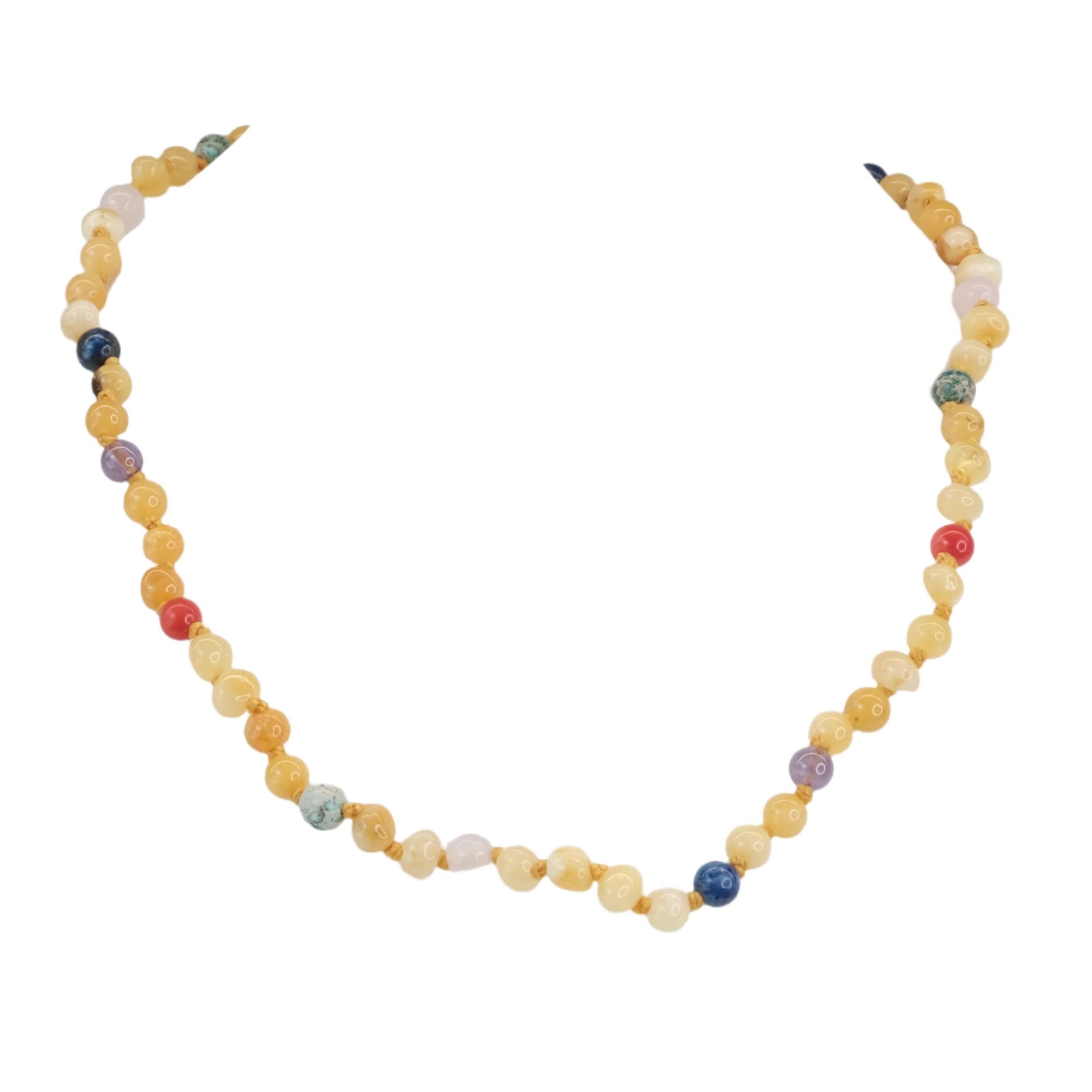 Children's amber necklace with multi-colored beads for healing and cleansing.