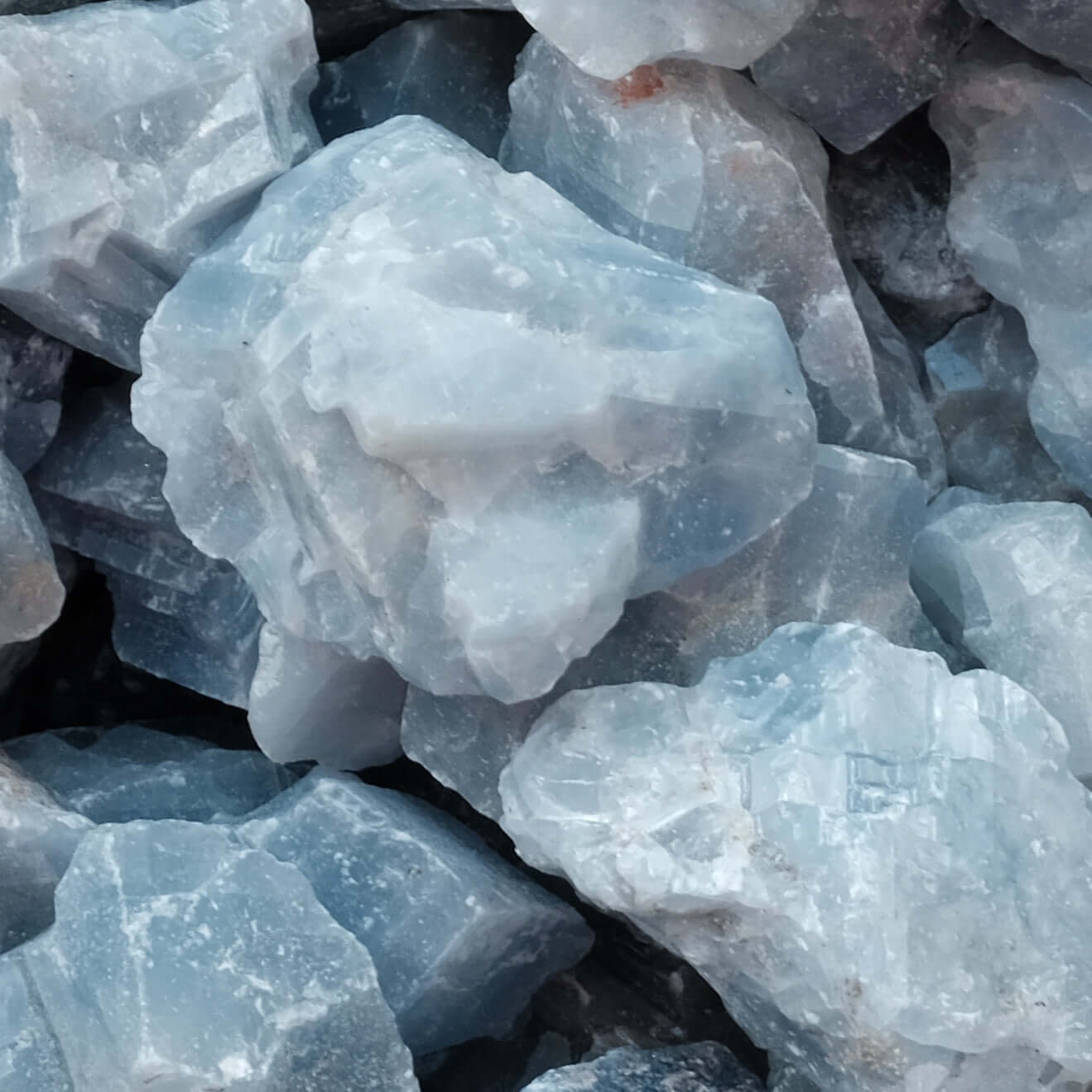 Raw blue calcite stones for healing, communication, and relaxation benefits. Ideal for energy absorption and memory enhancement.