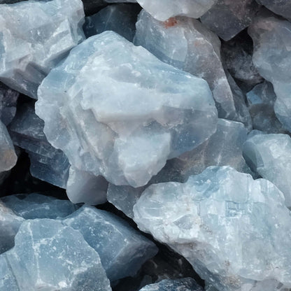 Raw blue calcite stones for healing, communication, and relaxation benefits. Ideal for energy absorption and memory enhancement.