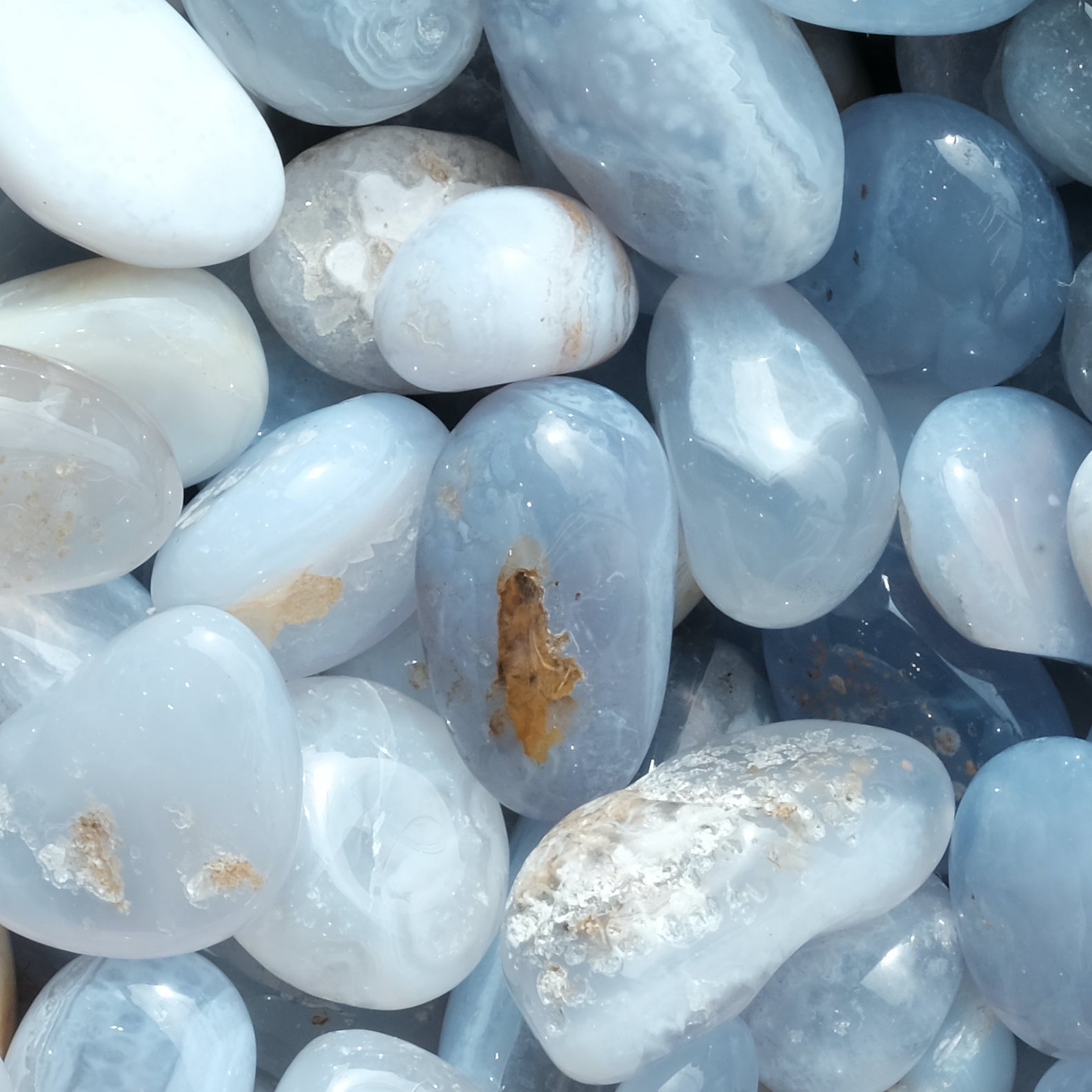 Blue Lace Agate tumbled stones for calming effect and throat healing, ideal for reducing inflammation and promoting self-assurance.