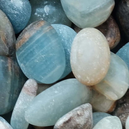 Blue Onyx tumbled stones for strength and confidence, enhances willpower, boosts peace of mind, and shields from negativity.