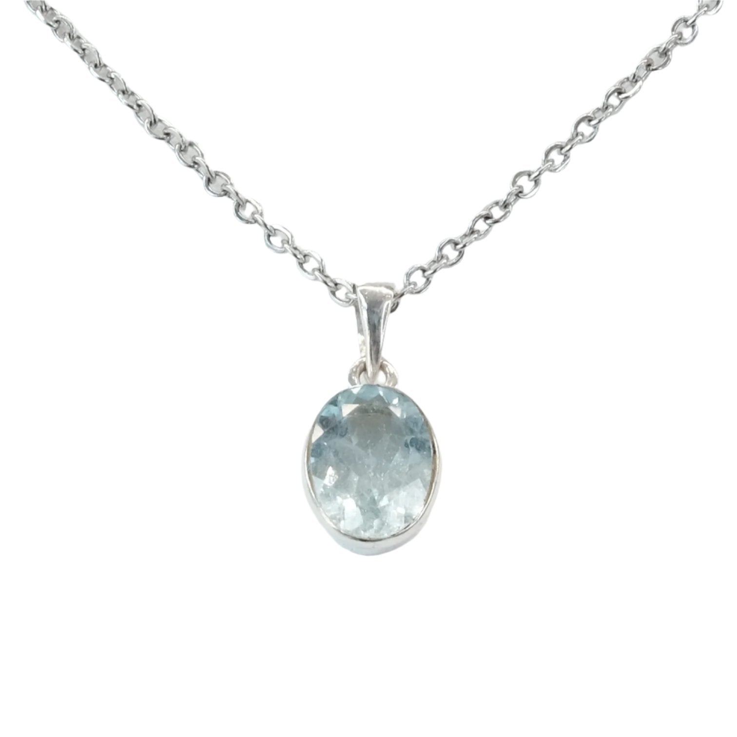 Elegant blue topaz silver pendant necklace with oval gemstone, symbolizing healing, love, and good fortune.