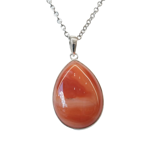 Carnelian Silver Pendant Necklace for vitality, creativity, and healing, featuring a polished teardrop carnelian stone on a silver chain.