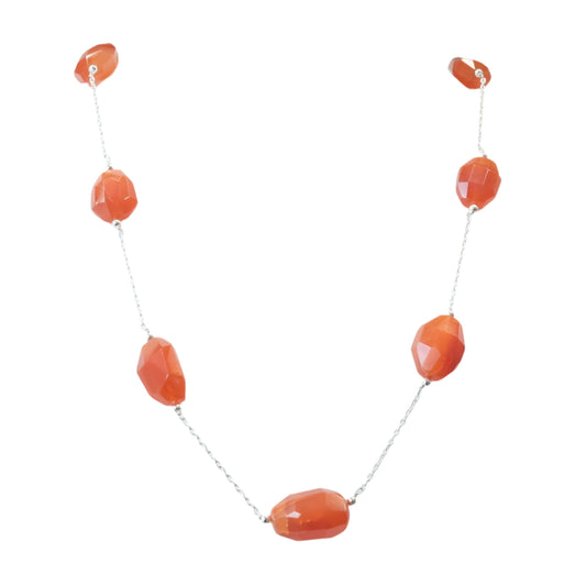 Carnelian sterling silver necklace with orange gemstones for vitality, creativity, and healing benefits.