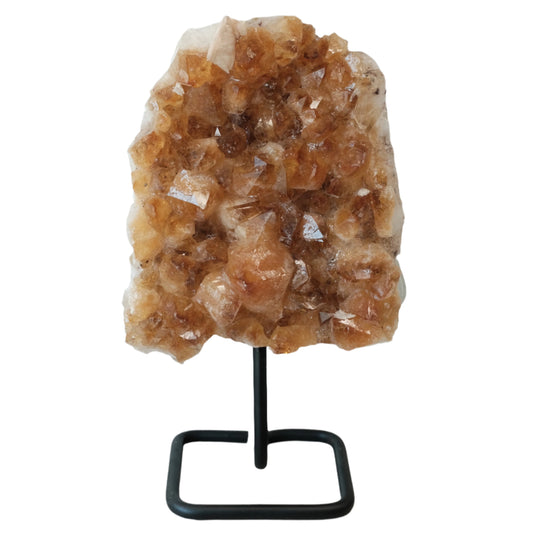 Citrine cluster on stand, energizing crystal for wealth and success, enhancing intuition and boosting self-confidence.