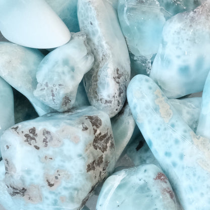 Larimar tumbled stones for healing and balancing energy, enhancing self-confidence, and throat chakra healing properties.