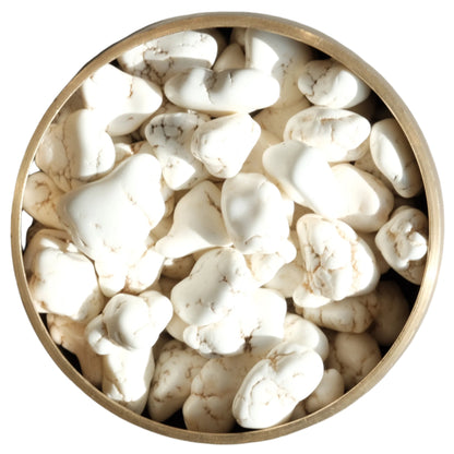 Bowl of raw white magnesite nuggets for mental clarity and positivity boosting.