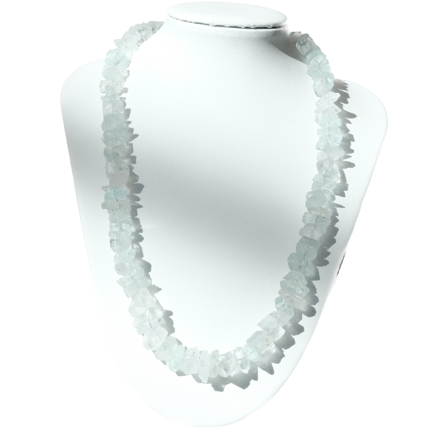 Aquamarine chip necklace on a white display bust, showcasing soothing light blue stones that promote calmness and reduce stress.