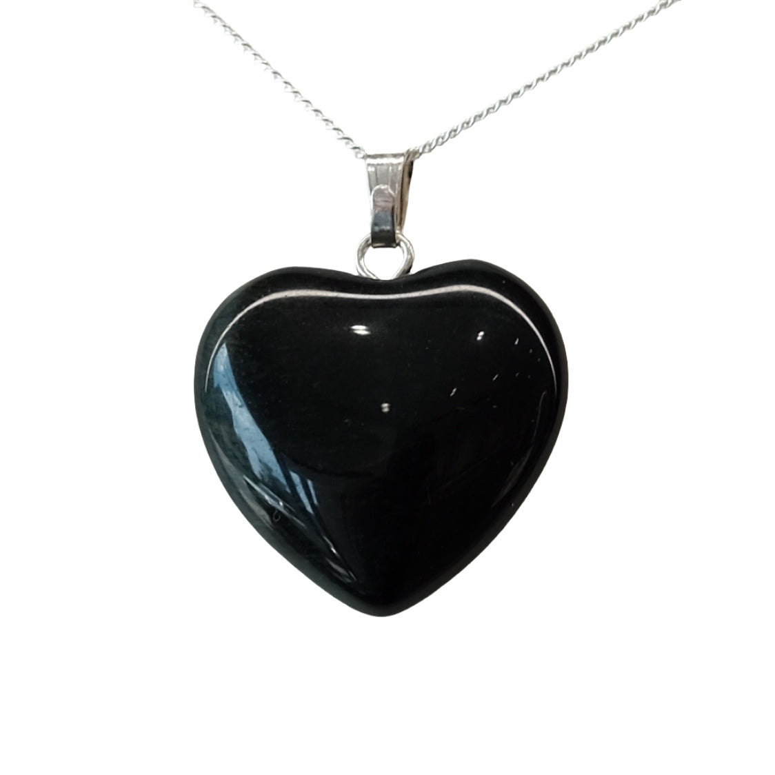 Black Obsidian Heart Pendant on silver chain, known for protection and enhancing truth.