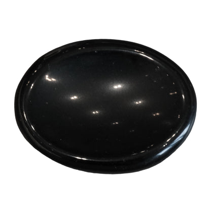 Black obsidian worry stone for mental clarity and stress relief, known for protection against negativity.