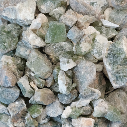 Raw peridot stones in varying sizes from 5 to 10mm, ideal for cleansing and boosting confidence and awareness.