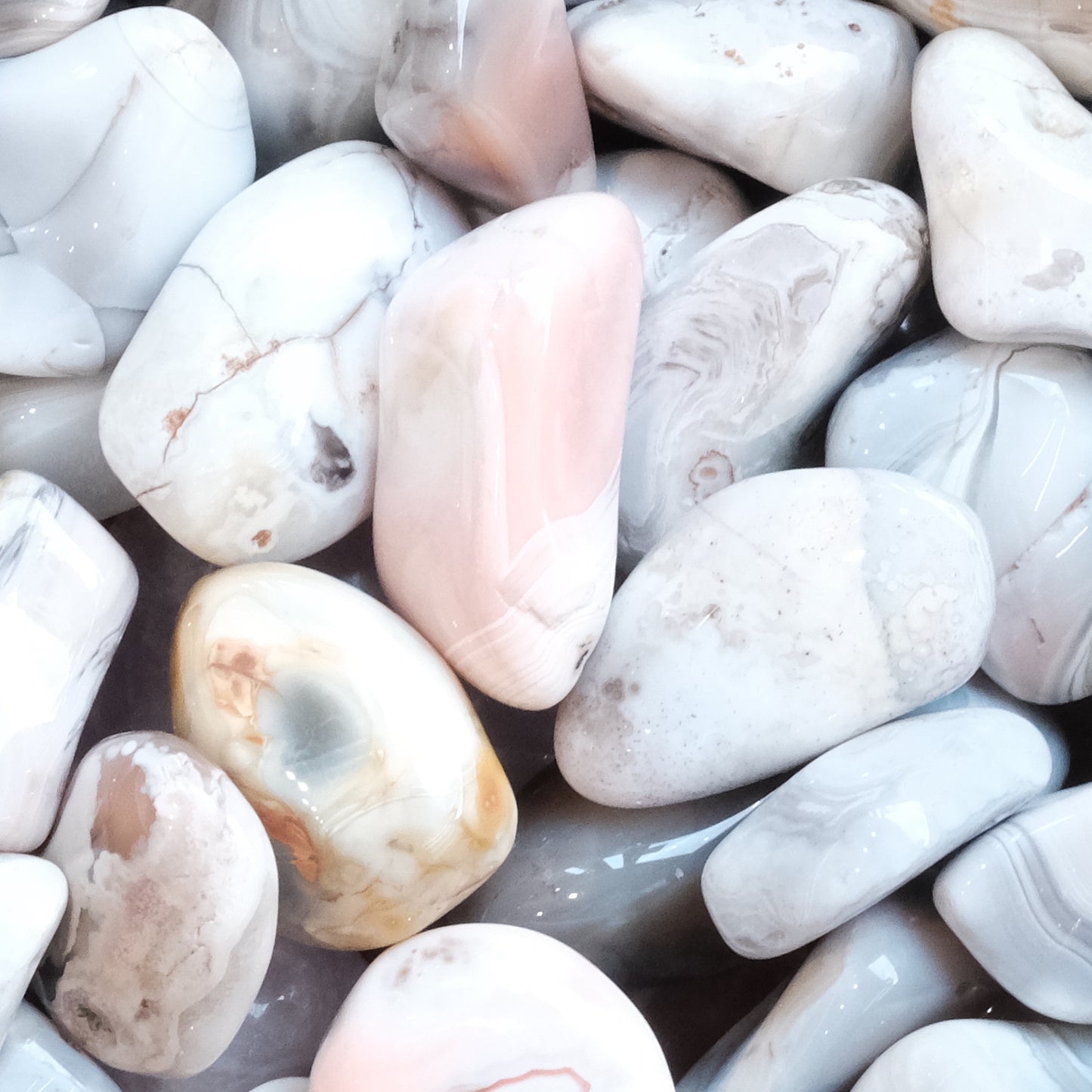 Pink Botswana Agate tumbled stones, known for encouraging creative thinking and aiding smokers with solutions-focused mindset.