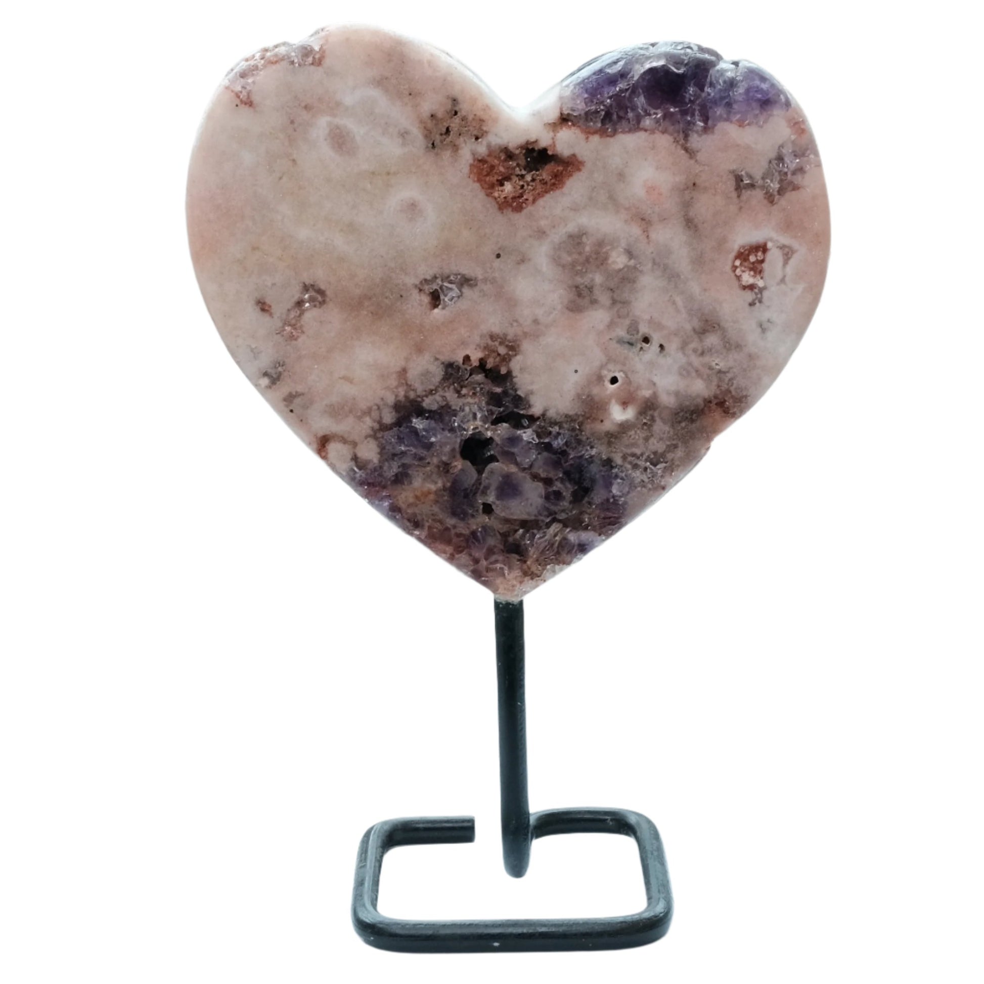 Pink amethyst heart on stand for meditation, enhances intuition and healing, perfect for yoga practice.