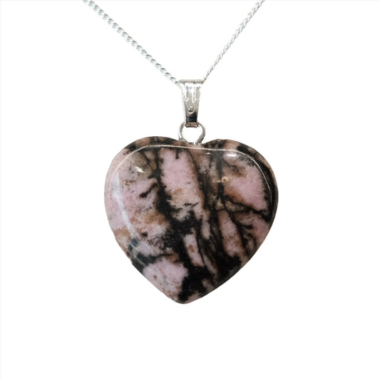 Rhodonite heart pendant necklace promoting emotional balance with pink and black patterns on a silver chain.