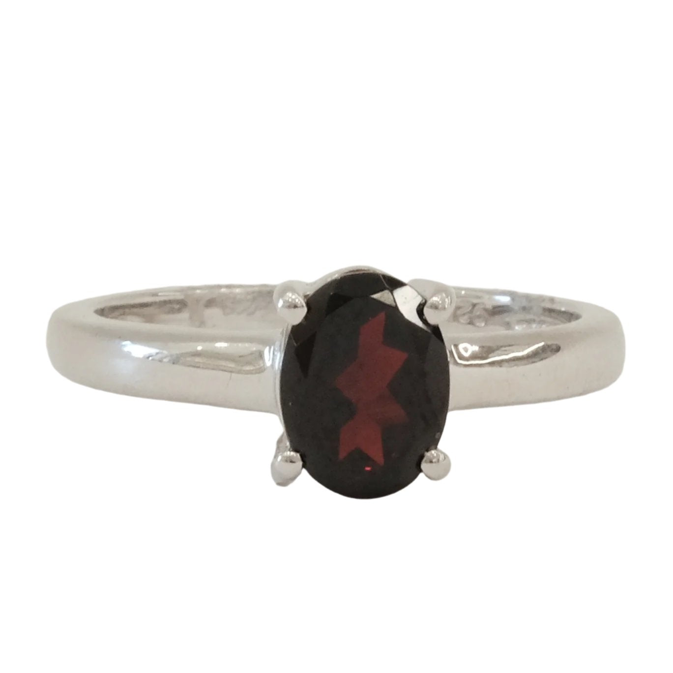 Garnet sterling silver ring size 7 with oval gemstone promoting confidence and energy balance.