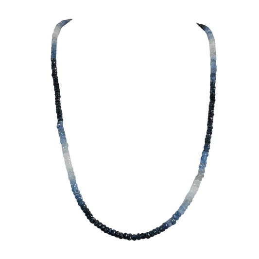 Blue sapphire necklace with gradient beads symbolizing wisdom and serenity, promoting concentration and peace of mind.