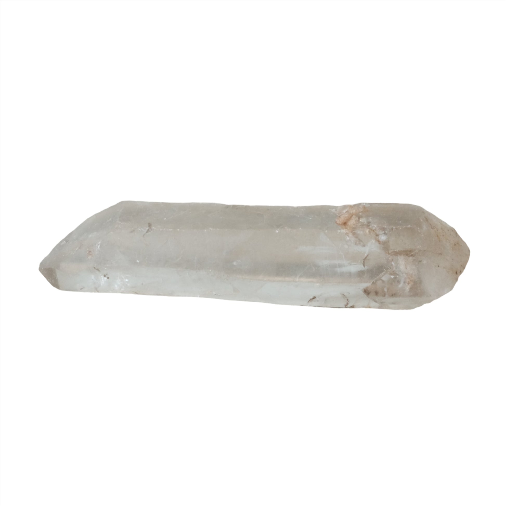 Clear quartz crystal point with rough edges on white background.