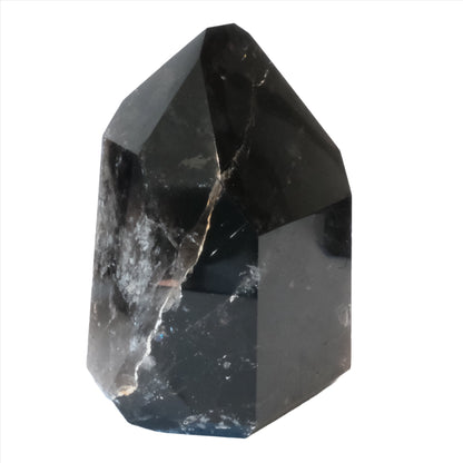 Smoky Quartz Tower for grounding and neutralizing negative energies with a polished, crystal-clear finish.