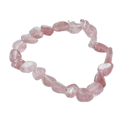 A beaded stretch bracelet made of irregular, polished pink gemstone beads, displayed on a clean white background.