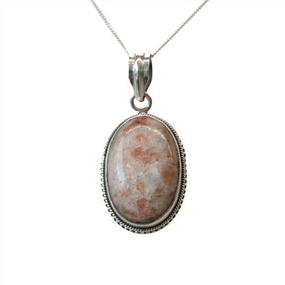 Sunstone sterling silver pendant necklace for luck and vitality, featuring an oval gemstone promoting self-empowerment and stress reduction.