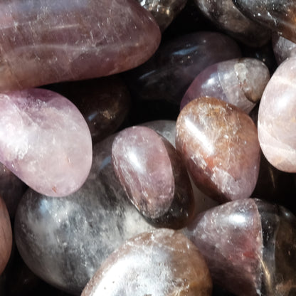 Super Seven tumbled stones for healing and energy balance, known for aligning mind, body, and spirit with vibrant vitality.