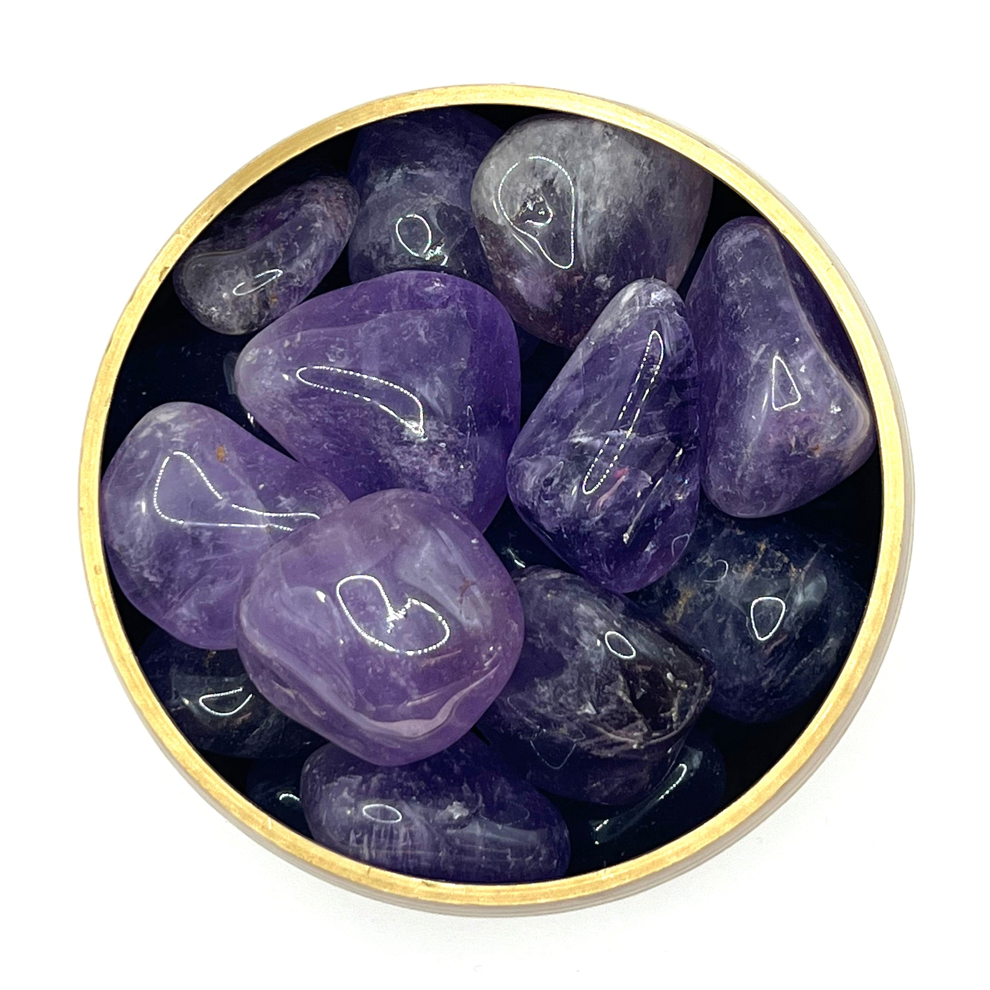 Amethyst pebble tumbled stones in a circular dish, promoting stress relief, mood stability, and spiritual openness.