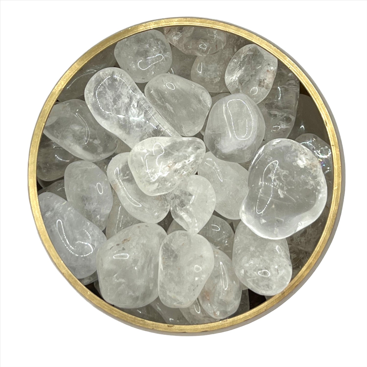 Clear Quartz tumbled stones in a round container, known for amplifying energy and enhancing focus and memory.